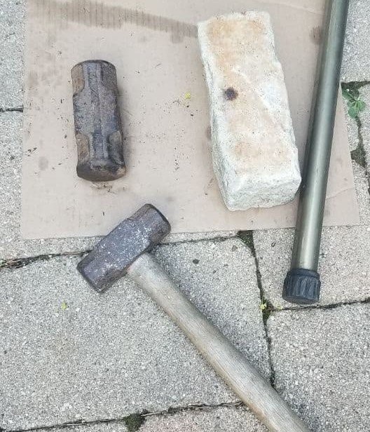 Granite curbstone, 5 pound sledgehammer head, 2.5 pound sledgehammer